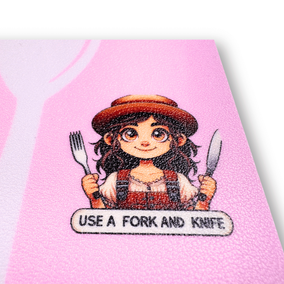 Safari-themed MealMate Grow placemat for girls aged 5-9, designed to teach table manners and encourage adventurous eating. The placemat features fun challenges like ‘Try at least one bite of everything on your plate,’ guiding children with interactive visual cues. Made from durable, easy-to-clean silicone and includes educational QR codes for extended learning. close up of illustration with speak bubble saying "Use a fork and knife"