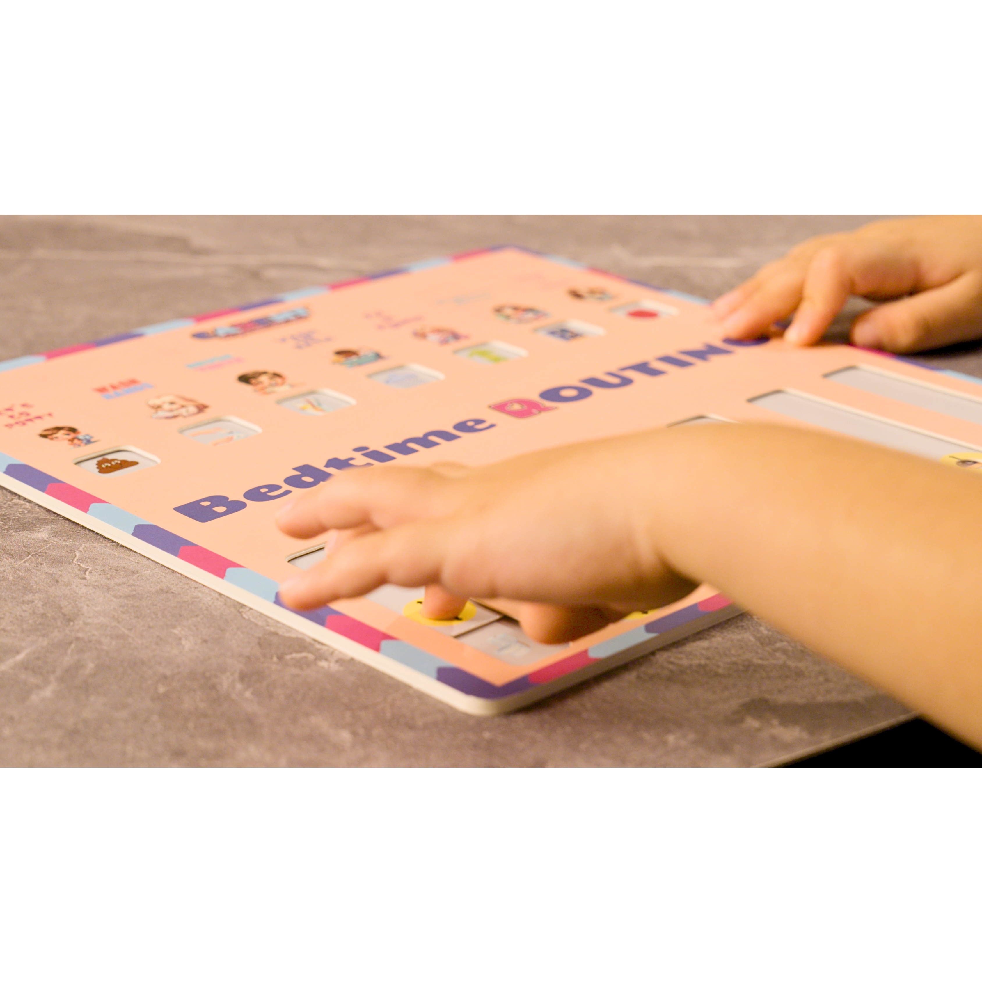 Little boy's hands sliding sliders on ROUTINO. 